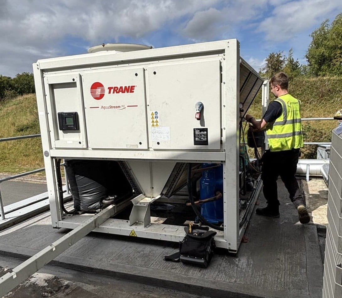 HVAC engineer servicing rooftop Trane chiller unit